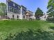 Spacious backyard featuring a lush lawn, mature trees, and a charming deck for outdoor enjoyment at 535 Crested Hawk Rdg, Canton, GA 30114