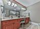 Elegant bathroom with double sinks, vanity, and walk-in shower at 535 Crested Hawk Rdg, Canton, GA 30114