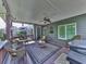 Covered deck area with ceiling fan and wicker furniture perfect for outdoor living at 535 Crested Hawk Rdg, Canton, GA 30114