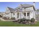 Gray two story house with wrap around porch and manicured lawn at 535 Crested Hawk Rdg, Canton, GA 30114