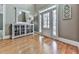 Welcoming foyer featuring gleaming hardwood floors, natural light, and stylish decor at 535 Crested Hawk Rdg, Canton, GA 30114