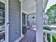 Inviting front porch with rocking chairs, classic columns, and a well-maintained exterior at 535 Crested Hawk Rdg, Canton, GA 30114