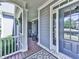 Charming front porch with rocking chairs, decorative columns, and inviting entrance at 535 Crested Hawk Rdg, Canton, GA 30114