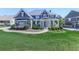 Stunning home featuring a manicured lawn, walkway, lush shrubbery, and covered front porch at 535 Crested Hawk Rdg, Canton, GA 30114