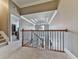 Hallway with carpet, railing, and a view of the chandelier and stairs at 535 Crested Hawk Rdg, Canton, GA 30114