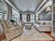 Stylish living room showcases a comfortable sitting area with many windows that provide natural light, plus built-in shelving at 535 Crested Hawk Rdg, Canton, GA 30114