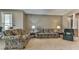 Comfortable living room with two sofas, an armchair, and neutral walls at 535 Crested Hawk Rdg, Canton, GA 30114