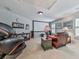Spacious living room with a large theater screen, comfortable seating, and natural light at 535 Crested Hawk Rdg, Canton, GA 30114