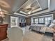 Spacious main bedroom with tray ceiling, fireplace, and adjacent bathroom with soaking tub at 535 Crested Hawk Rdg, Canton, GA 30114
