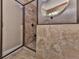 Modern walk-in shower features a glass door and decorative tile work with a built-in showerhead system at 535 Crested Hawk Rdg, Canton, GA 30114