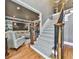 Elegant staircase showcasing carpeted steps, iron railings, and open view to the living room at 535 Crested Hawk Rdg, Canton, GA 30114