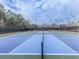 Outdoor tennis courts featuring a new surface and net at 535 Crested Hawk Rdg, Canton, GA 30114