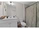 Clean bathroom with a white vanity and shower/tub combo at 6188 Lanier Harbor Lndg, Buford, GA 30518