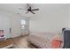 Cozy bedroom featuring floral bedding and a ceiling fan at 6188 Lanier Harbor Lndg, Buford, GA 30518