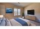 Main bedroom with TV stand and plenty of natural light at 1696 Winchester Se Way, Conyers, GA 30013