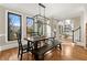 Sunlit dining area with dark wood table and bench seating at 4455 Leesburg Rd, Marietta, GA 30066