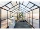 Spacious greenhouse with potting bench and various plants at 4455 Leesburg Rd, Marietta, GA 30066