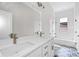 Elegant bathroom with double vanity, white subway tile, and patterned floor at 774 Tift Sw Ave, Atlanta, GA 30310