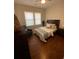 Spacious bedroom with hardwood floors, ceiling fan, and ample natural light at 774 Tift Sw Ave, Atlanta, GA 30310