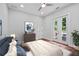 Spacious bedroom with hardwood floors, private balcony access and modern decor at 774 Tift Sw Ave, Atlanta, GA 30310