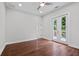 Light-filled bedroom featuring hardwood floors and French doors at 774 Tift Sw Ave, Atlanta, GA 30310