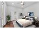 Serene bedroom with hardwood floors, access to a deck, and a modern feel at 774 Tift Sw Ave, Atlanta, GA 30310
