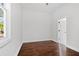 Bright bedroom with hardwood floors and access to a bathroom at 774 Tift Sw Ave, Atlanta, GA 30310