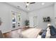 Bright bedroom with hardwood floors and access to a private deck at 774 Tift Sw Ave, Atlanta, GA 30310