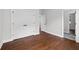 Well-lit bedroom with hardwood floors and double doors to closet at 774 Tift Sw Ave, Atlanta, GA 30310