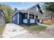 Newly renovated home with a blue exterior, white columns, and a large front yard at 774 Tift Sw Ave, Atlanta, GA 30310