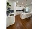 Modern kitchen with white cabinets, quartz countertops, and dark blue herringbone backsplash at 774 Tift Sw Ave, Atlanta, GA 30310