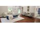Bright living room featuring hardwood floors, comfy seating, and a stylish rug at 774 Tift Sw Ave, Atlanta, GA 30310