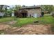 The backyard features a raised deck, a lower-level walkout, and a spacious yard area at 992 Brian Ln, Forest Park, GA 30297