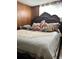 The bedroom has wood-paneled walls and is decorated with plush animals and decorative pillows at 992 Brian Ln, Forest Park, GA 30297