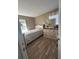 Cozy bedroom with a well-lit window, dresser with decor, and comfortable bed at 992 Brian Ln, Forest Park, GA 30297