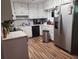 Efficient kitchen features white cabinets, modern appliances, and laminate flooring, perfect for preparing meals at 992 Brian Ln, Forest Park, GA 30297