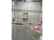 Modern shower with dual showerheads, a niche for toiletries, and mosaic tile flooring at 992 Brian Ln, Forest Park, GA 30297