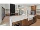Open kitchen and living room concept with modern fireplace and stainless steel appliances at 1820 Lake Dow Rd, Mcdonough, GA 30252