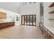 Open floor plan with a modern fireplace, multi-panel doors to backyard, and kitchen at 1820 Lake Dow Rd, Mcdonough, GA 30252