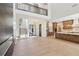Open concept living area with two-story high ceilings, modern fireplace, and kitchen at 1820 Lake Dow Rd, Mcdonough, GA 30252