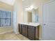 Bathroom with dark brown vanity and a large mirror at 2686 Caleb James Rd, Marietta, GA 30064