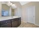Double vanity bathroom with a large mirror and dark brown cabinets at 2686 Caleb James Rd, Marietta, GA 30064
