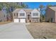Two-story brick home with attached two-car garage and landscaped yard at 2686 Caleb James Rd, Marietta, GA 30064