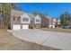 Row of townhouses with attached garages and shared driveway at 2686 Caleb James Rd, Marietta, GA 30064