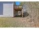 Home's exterior showcasing a raised deck and private backyard at 2686 Caleb James Rd, Marietta, GA 30064