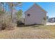 Side yard view of house with privacy and mature trees at 2686 Caleb James Rd, Marietta, GA 30064