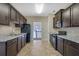 Open concept kitchen with dark cabinets and breakfast bar at 2686 Caleb James Rd, Marietta, GA 30064