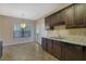 Kitchen boasts dark wood cabinets, granite countertops, and a breakfast nook at 2686 Caleb James Rd, Marietta, GA 30064