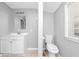 Simple bathroom with toilet and sink vanity at 281 Valley Lake Dr, Stone Mountain, GA 30087
