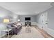 Finished basement with living area, stylish decor, and ample lighting at 641 Virginia Ave, Suwanee, GA 30024